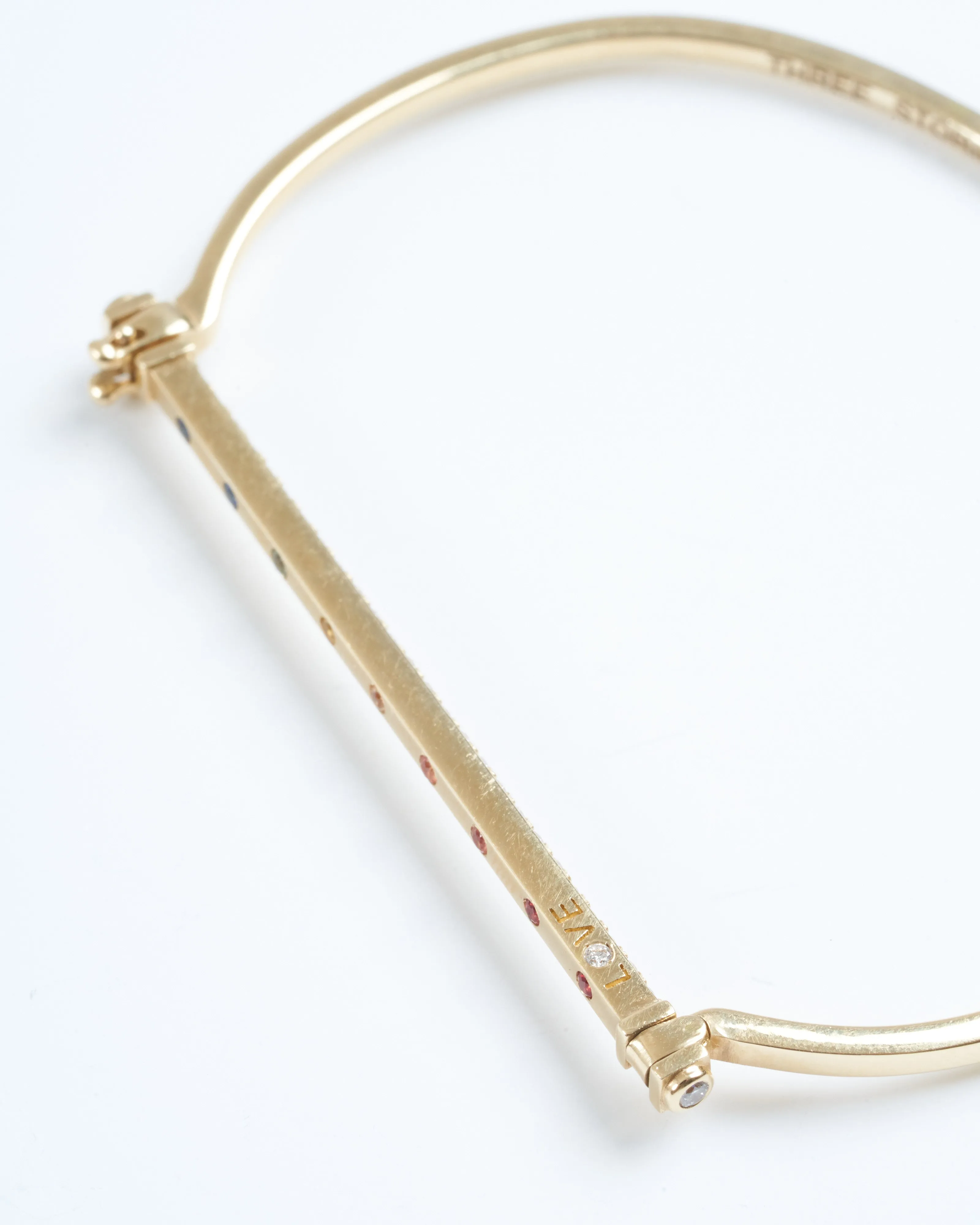narrow love flip bangle